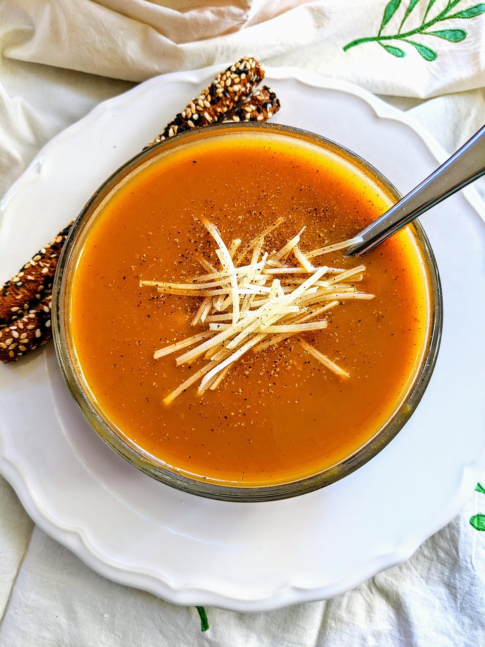 Tomato soup topped with cheese.